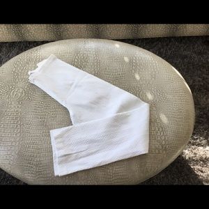 White pants with tone on tone small print.